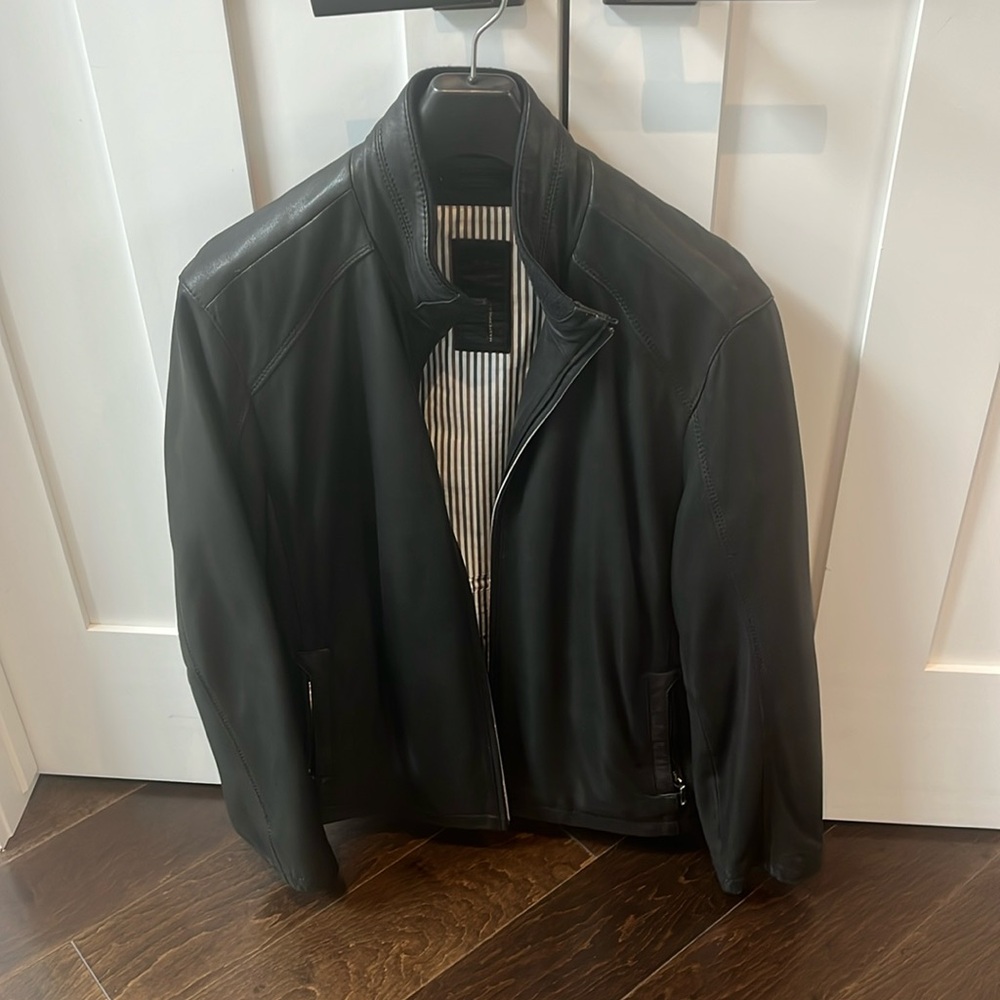 Black leather jacket by Trapper. Size L